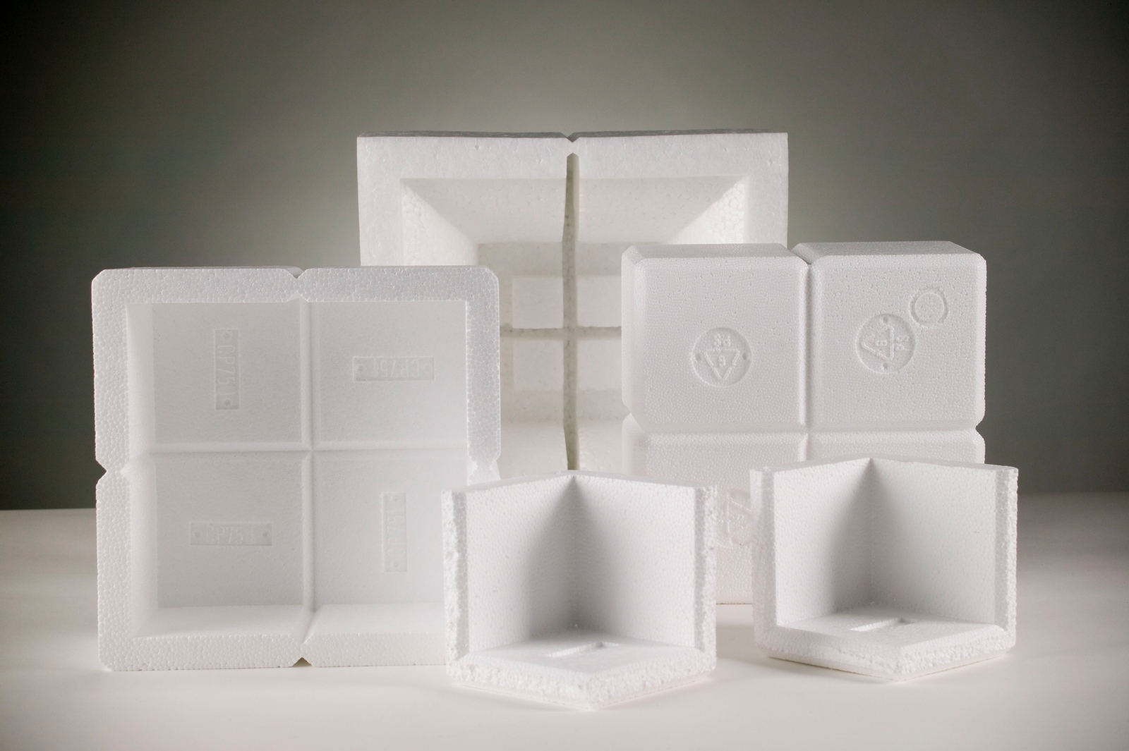 Several custom Atlas protective packaging products made from EPS.